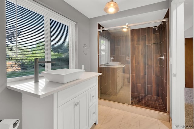 5622 E Weaver Cir, Centennial, CO 80111 - bathroom featuring vanity, a shower stall, and marble look tile flooring