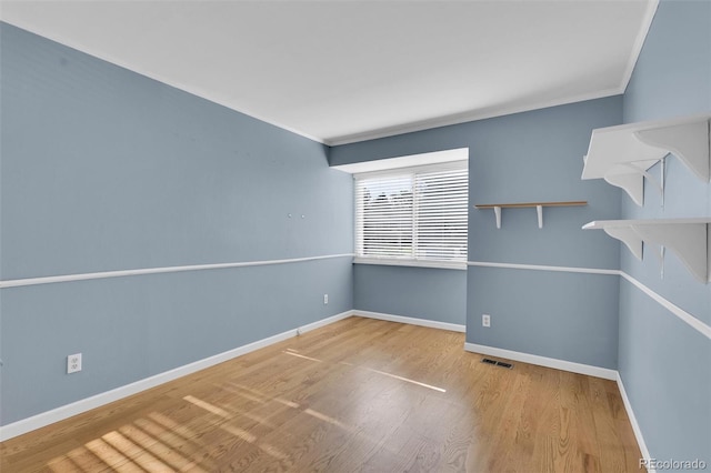 5622 E Weaver Cir, Centennial, CO 80111 - unfurnished room featuring wood finished floors, baseboards, and crown molding