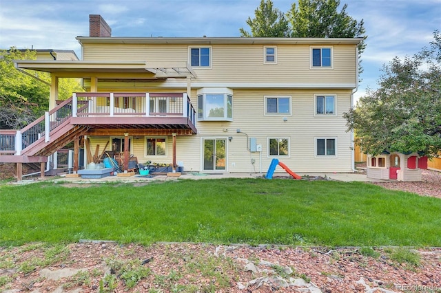 5622 E Weaver Cir, Centennial, CO 80111 - back of house with a chimney, a wooden deck, a lawn, and stairs