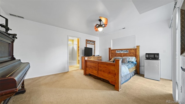 80 Cliff View Cir, Parachute, CO 81635 - bedroom with light carpet, refrigerator, ensuite bath, and ceiling fan