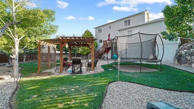 80 Cliff View Cir, Parachute, CO 81635 - fenced backyard featuring a trampoline, a patio, and a pergola