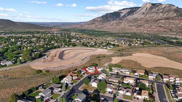 80 Cliff View Cir, Parachute, CO 81635 - aerial view of property and surrounding area with mountains and nearby suburban area