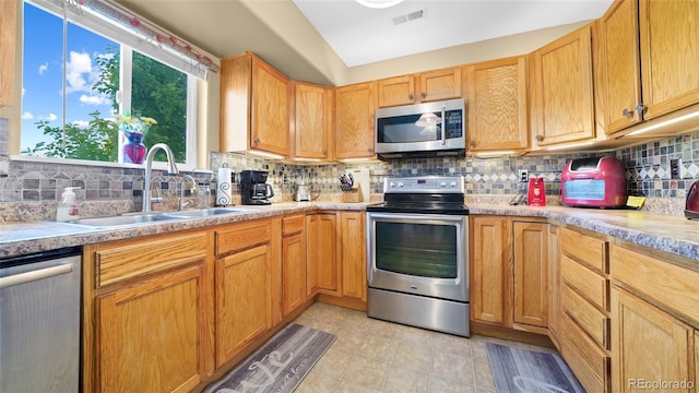 80 Cliff View Cir, Parachute, CO 81635 - kitchen featuring appliances with stainless steel finishes, light countertops, tasteful backsplash, and light tile patterned floors