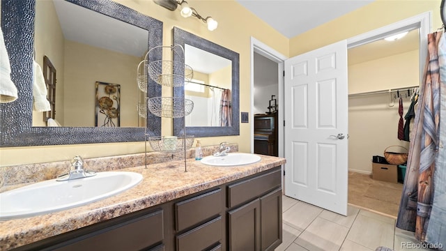 80 Cliff View Cir, Parachute, CO 81635 - full bath with double vanity, a walk in closet, and a shower with curtain