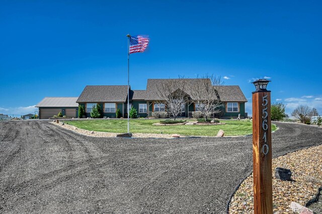 55610 E 40th Ave, Strasburg, CO 80136 - single story home featuring a front yard