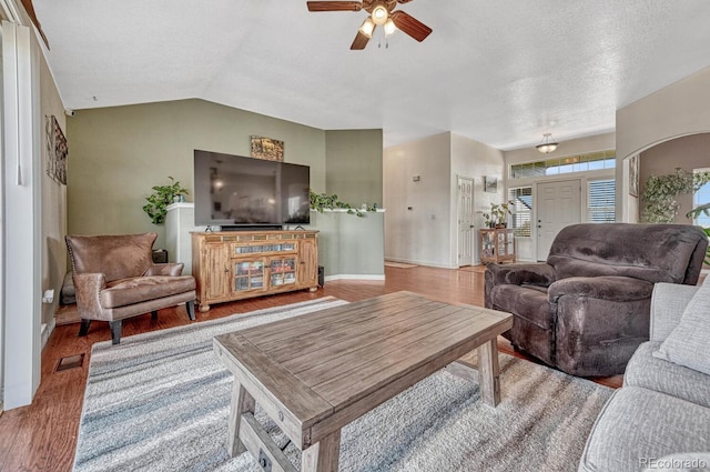 55610 E 40th Ave, Strasburg, CO 80136 - living room with a ceiling fan, wood finished floors, a textured ceiling, and vaulted ceiling
