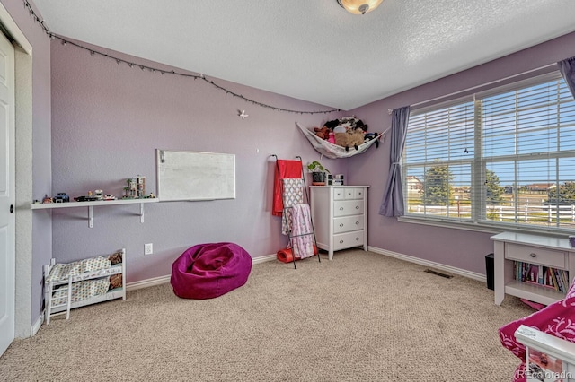 55610 E 40th Ave, Strasburg, CO 80136 - carpeted bedroom with a textured ceiling and baseboards