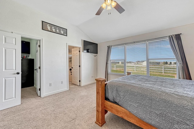 55610 E 40th Ave, Strasburg, CO 80136 - carpeted bedroom featuring vaulted ceiling, multiple windows, a walk in closet, and ceiling fan
