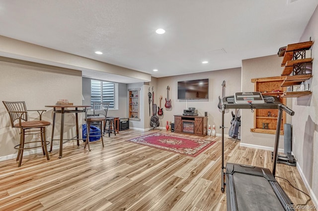 55610 E 40th Ave, Strasburg, CO 80136 - exercise area with wood finished floors and recessed lighting