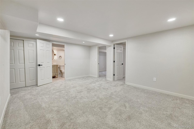 finished basement featuring baseboards, carpet flooring, and recessed lighting