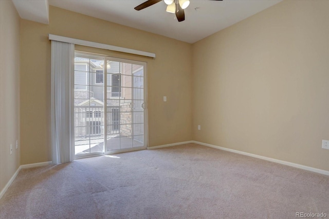 unfurnished room with a ceiling fan, baseboards, and carpet floors