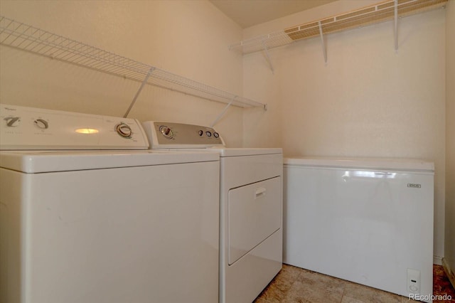 clothes washing area with laundry area and separate washer and dryer
