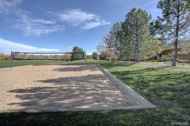 surrounding community featuring volleyball court and a lawn