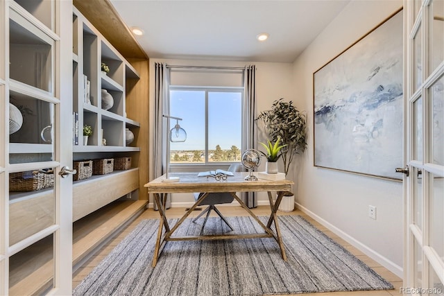 office space with french doors and tile patterned flooring