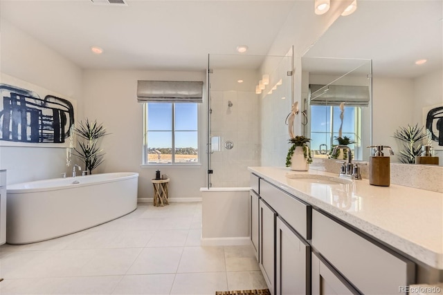 bathroom featuring vanity, separate shower and tub, and tile patterned flooring