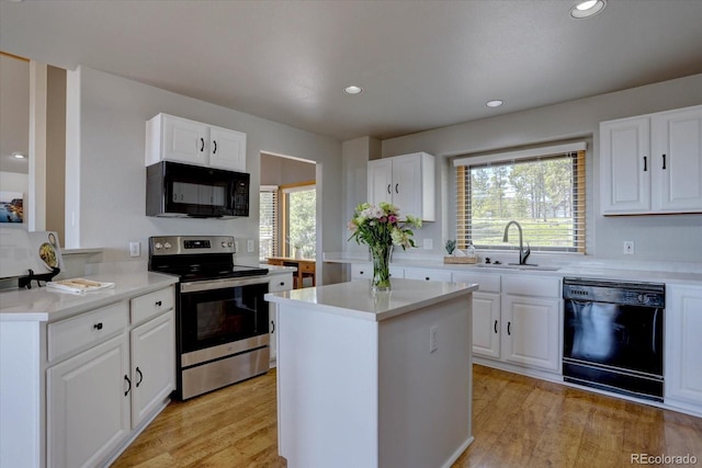 32091 Black Widow Dr, Conifer, CO 80433 - kitchen featuring black appliances, healthy amount of natural light, light wood-style flooring, and recessed lighting