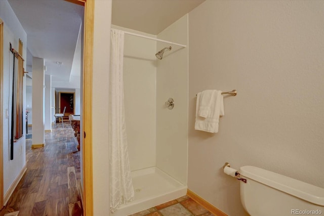 32091 Black Widow Dr, Conifer, CO 80433 - bathroom featuring a shower stall and wood finished floors