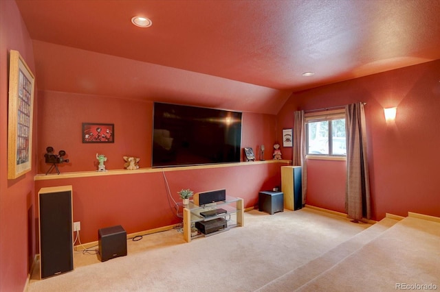 32091 Black Widow Dr, Conifer, CO 80433 - home theater room featuring carpet flooring, vaulted ceiling, recessed lighting, and a textured ceiling