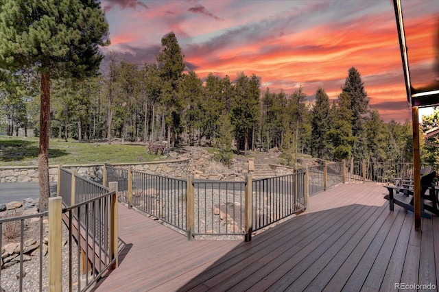 32091 Black Widow Dr, Conifer, CO 80433 - deck at dusk with view of scattered trees
