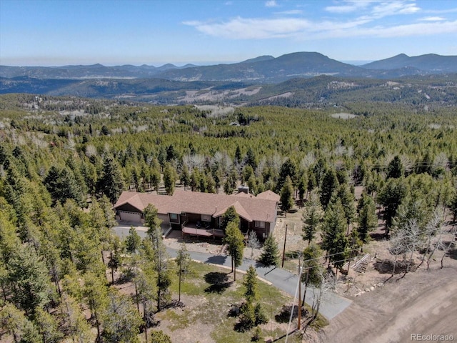 32091 Black Widow Dr, Conifer, CO 80433 - view of mountain backdrop featuring a heavily wooded area