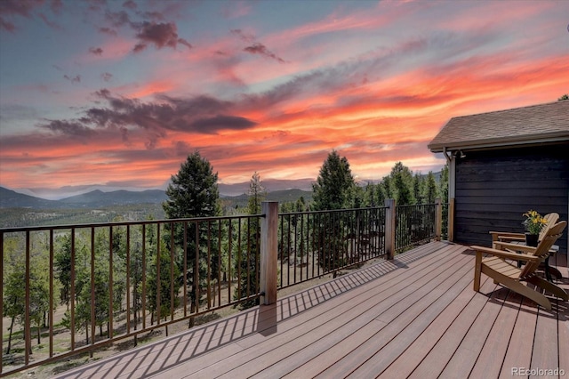 32091 Black Widow Dr, Conifer, CO 80433 - deck at dusk with a mountain view