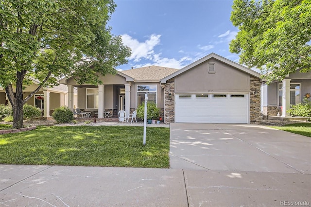 view of front of home with a garage and a front lawn