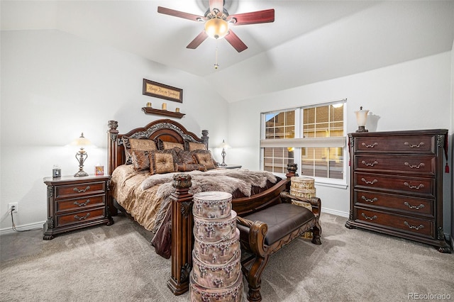 bedroom with light colored carpet, vaulted ceiling, and ceiling fan