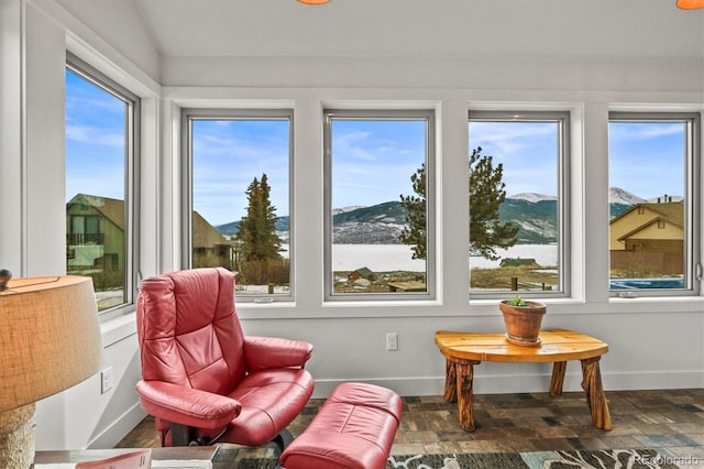 sunroom / solarium with a mountain view