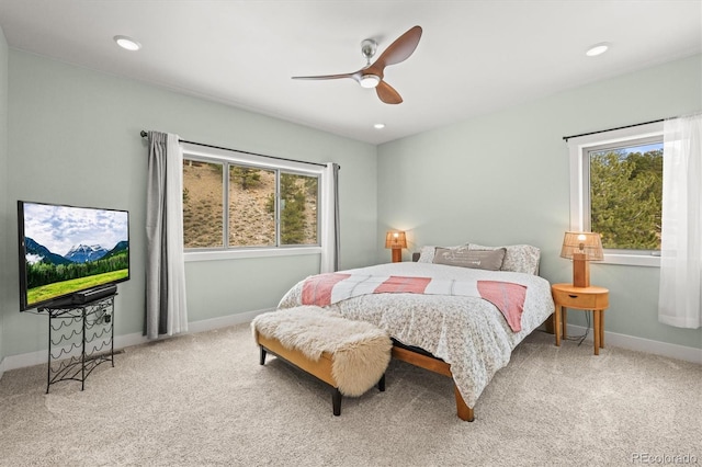 bedroom with carpet floors, recessed lighting, multiple windows, and baseboards