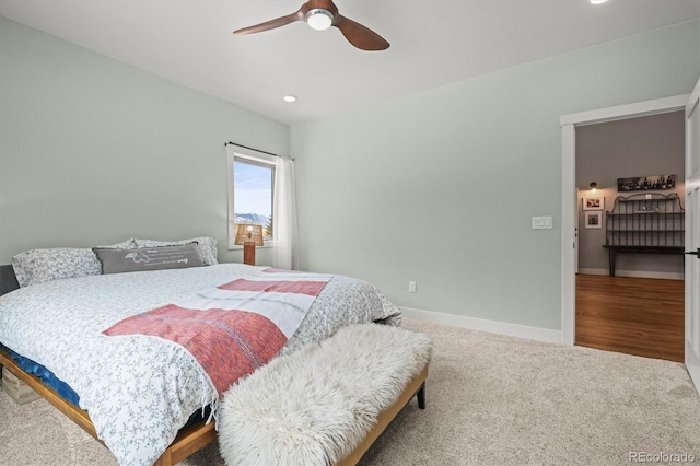 bedroom featuring ceiling fan, baseboards, and carpet flooring