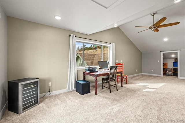 carpeted office featuring vaulted ceiling, beverage cooler, ceiling fan, and baseboards