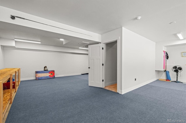 recreation room featuring baseboards and carpet flooring