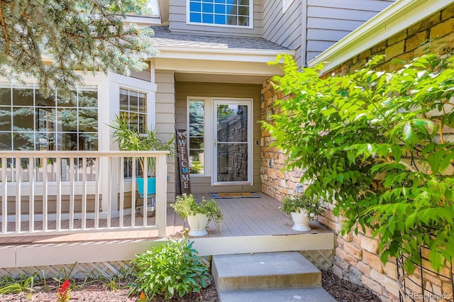 7166 Newhall Dr, Highlands Ranch, CO 80130 - entrance to property featuring a deck and stone siding