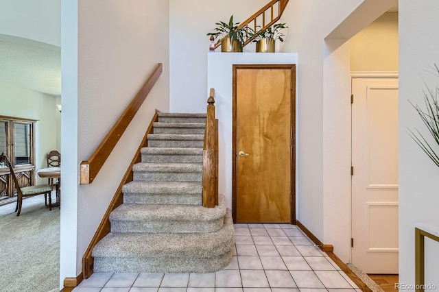 7166 Newhall Dr, Highlands Ranch, CO 80130 - stairs featuring tile patterned flooring