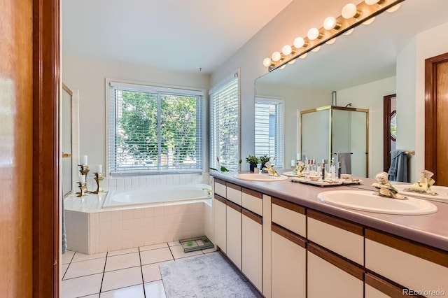 7166 Newhall Dr, Highlands Ranch, CO 80130 - full bath with a stall shower, double vanity, a bath, and tile patterned floors