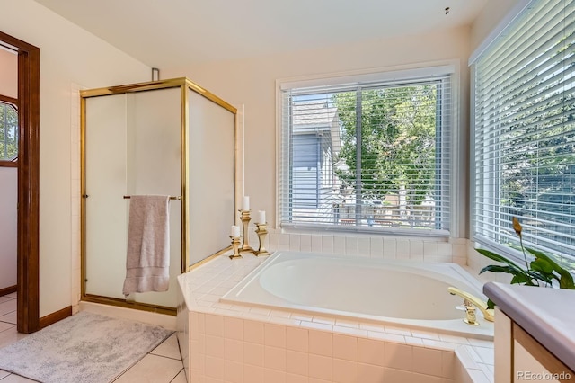 7166 Newhall Dr, Highlands Ranch, CO 80130 - bathroom with healthy amount of natural light, a stall shower, and a garden tub