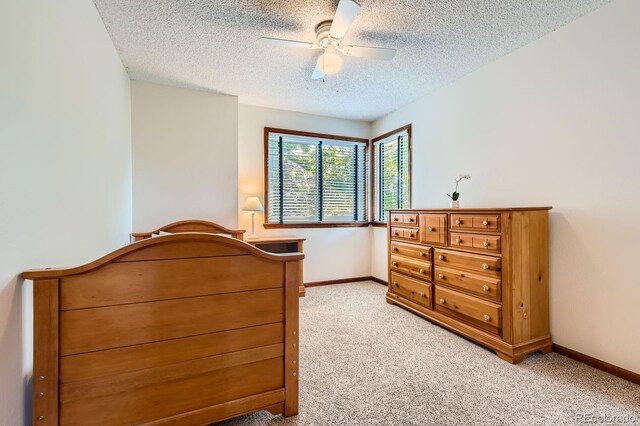 7166 Newhall Dr, Highlands Ranch, CO 80130 - bedroom with a textured ceiling, light carpet, and ceiling fan