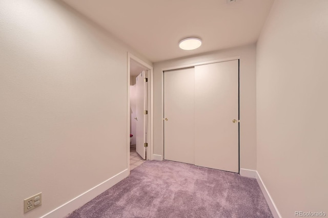 7166 Newhall Dr, Highlands Ranch, CO 80130 - hallway featuring carpet and baseboards
