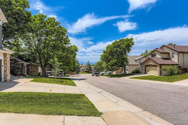 7166 Newhall Dr, Highlands Ranch, CO 80130 - view of asphalt road with sidewalks and a residential view