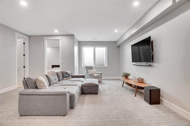 carpeted living room featuring recessed lighting and baseboards