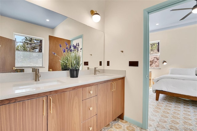1023 Chippewa Rd, Jefferson, CO 80456 - bathroom with double vanity, a ceiling fan, ensuite bath, and recessed lighting