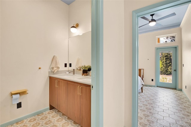 1023 Chippewa Rd, Jefferson, CO 80456 - bathroom featuring double vanity, ceiling fan, baseboards, and tile patterned flooring