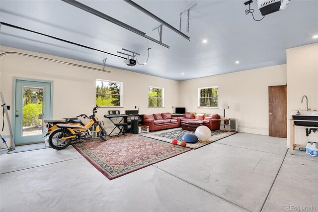 1023 Chippewa Rd, Jefferson, CO 80456 - garage featuring a garage door opener, recessed lighting, and a sink