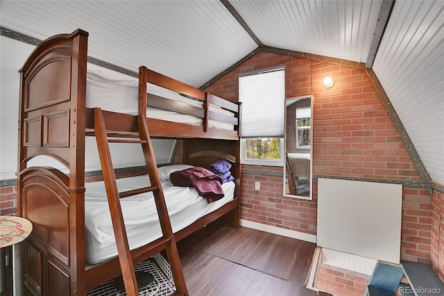 1023 Chippewa Rd, Jefferson, CO 80456 - bedroom featuring brick wall, wood finished floors, lofted ceiling, and wood ceiling