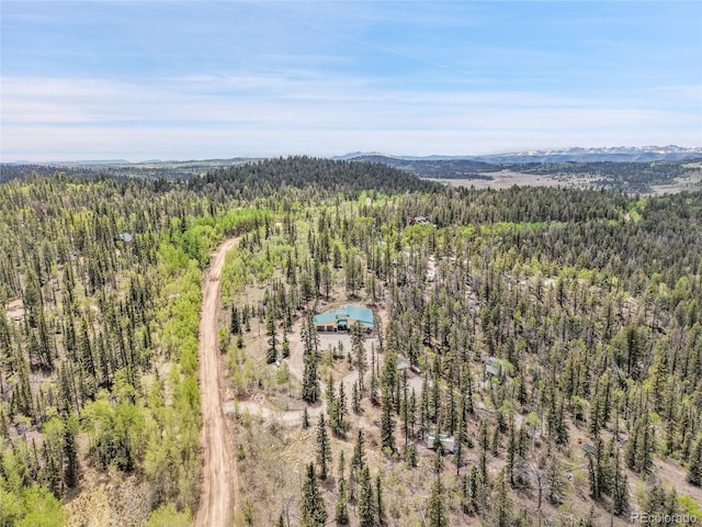 1023 Chippewa Rd, Jefferson, CO 80456 - drone / aerial view of a heavily wooded area and mountains