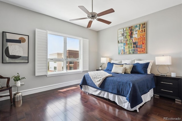 4875 S Monaco St Unit 303, Denver, CO 80237 - bedroom featuring baseboards, wood finished floors, and ceiling fan