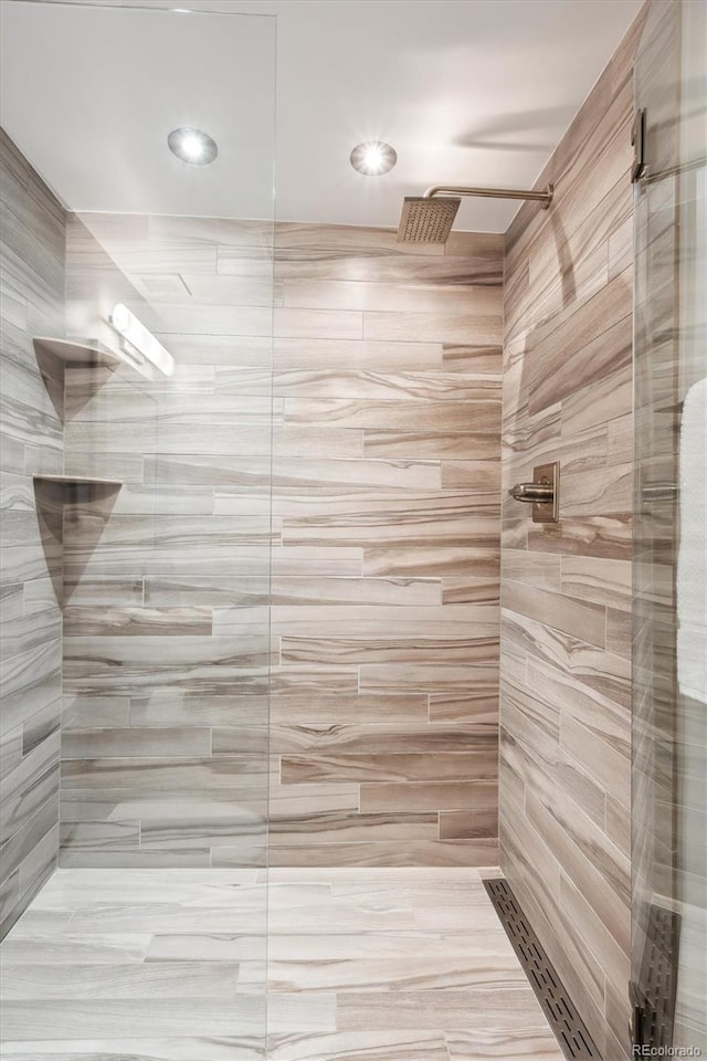 4875 S Monaco St Unit 303, Denver, CO 80237 - bathroom with tiled shower and recessed lighting