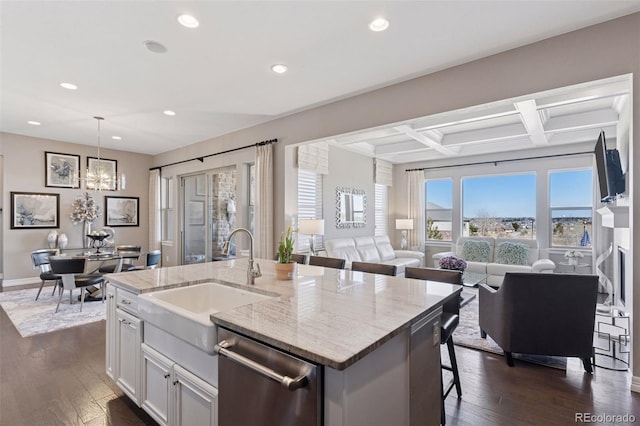 kitchen featuring open floor plan, an island with sink, recessed lighting, a sink, and dishwasher