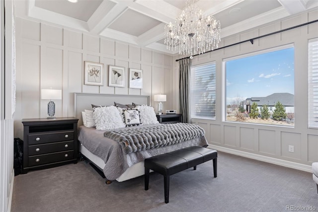 bedroom featuring coffered ceiling, a decorative wall, and a notable chandelier