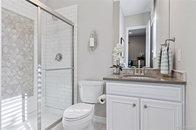 bathroom featuring vanity, ensuite bath, a stall shower, and toilet